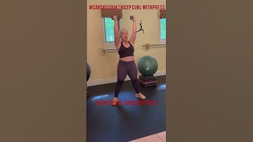 Deep squat with low bicep curl to a standing shoulder press