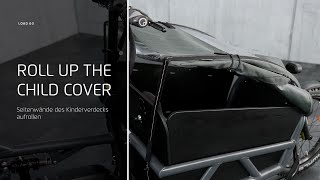 Load 60: How to roll up the sides of the child cover