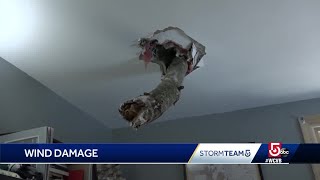 Tree limb breaks through Mass. family's roof during high winds
