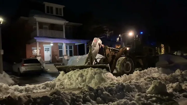 Pushing snow banks back with a CAT 930K for a snow...