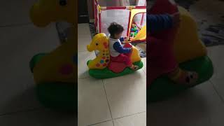 Baby Sit Opposite On Toy Horse... Searching Horse Face