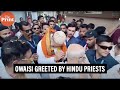 Asaduddin owaisi greeted by hindu priests on campaign trail