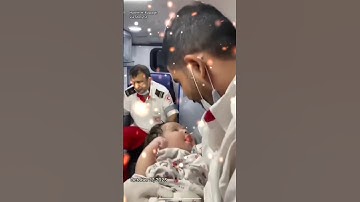 Gaza emergency worker breaks down in tears while cradling baby #shorts