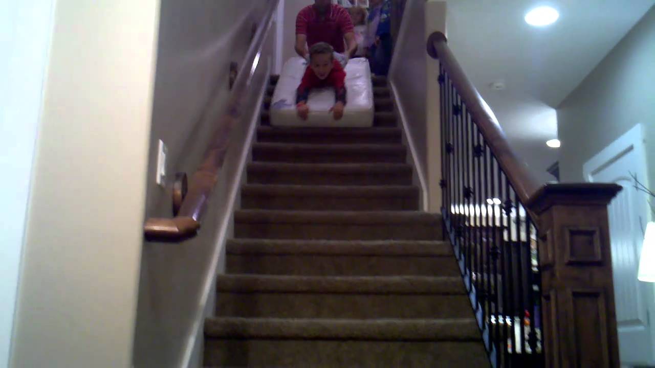 Connor riding down stairs at our friends home.
