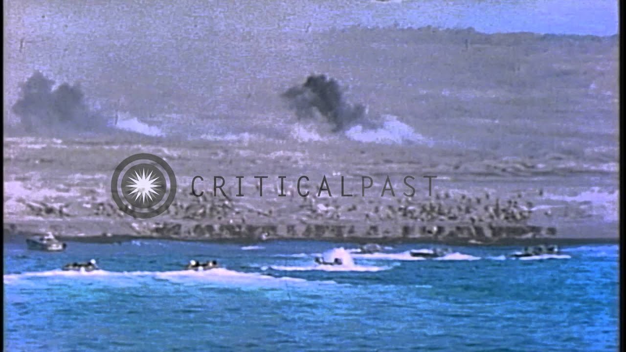 Bombing and firing at a beach and Mount Suribachi in Iwo Jima, Japan by US Marine...HD Stock Footage