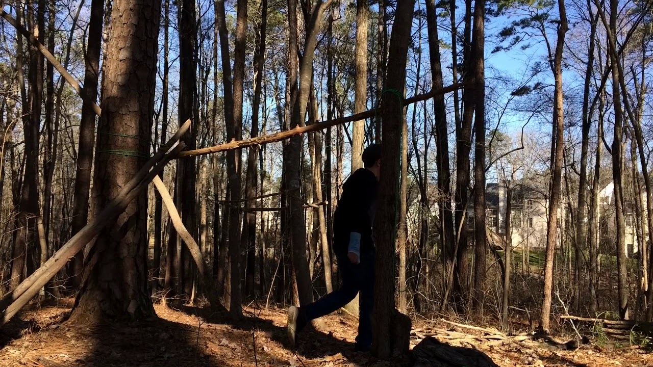 BUILDING A SURVIVAL SHELTER! - YouTube
