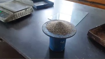 Determination of dry density by sand replacement method