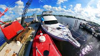 Moving a 52' Hatteras with Engine Failure, Tied up to Barge, and Moving into Pirates Cove Marina