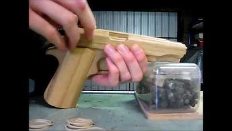 Loading the blowback rubber band gun