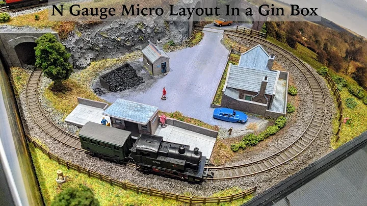 Model Trains Running On a Micro Layout Inside a Gin Box