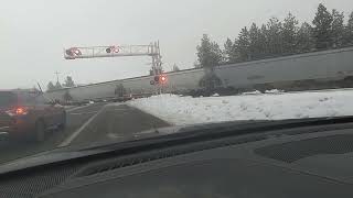 BNSF grain train single locomotive at each end, running empty through North Idaho at 60MPH