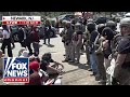 WATCH: Protesters CLASH with federal agents outside NJ facility