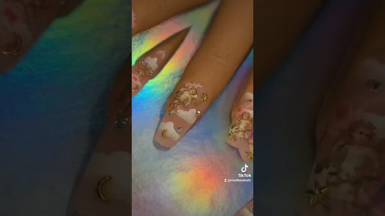 Get into the love vibe with these cupid nails! 