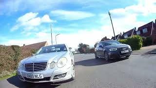 angry mans hits a cyclist and road rages over it