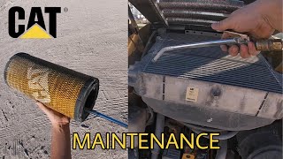 POV CAT skid steer cleaning air filter and radiator. MANDATORY maintenance