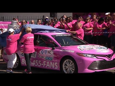 NASCAR stars paint the wall pink at Charlotte Motor Speedway