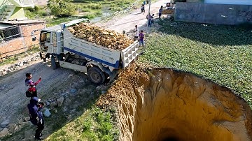 Land clearing, small-scale land filling operations using Komatsu D20-P bulldozer, earth moving truck