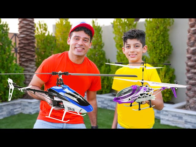 Jason plays with new helicopter and airplane challenge class=