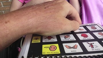 Harper talking with mom using PODD