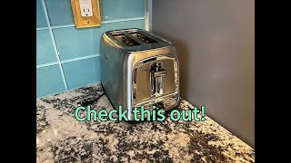 Is this Oster toaster easy to clean and does it prevent crumb spills?