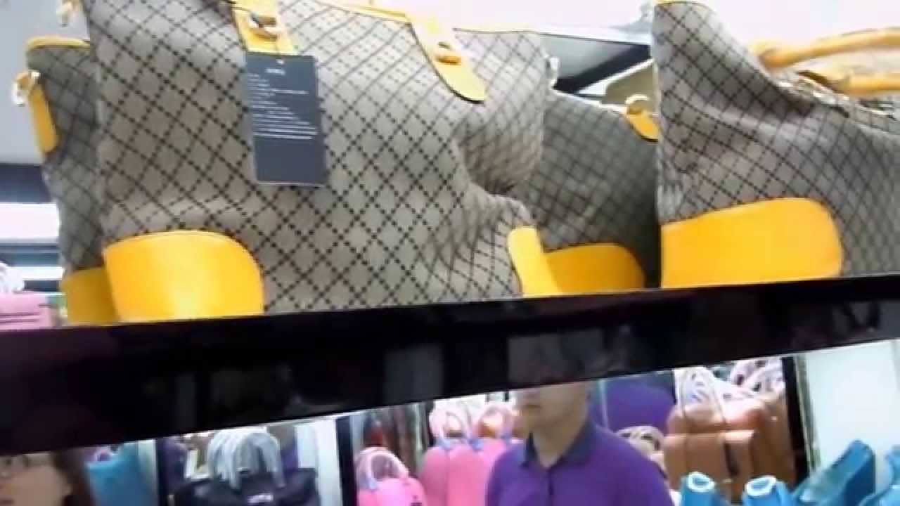 Fake luxury purses are sold on a sidewalk in downtown Guiyang, the capital  of China's Guizhou