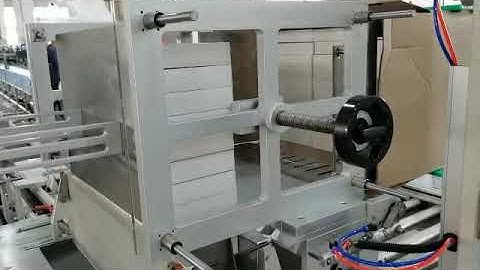 Automatic carton packing machine for filling cartons or boxes into case
