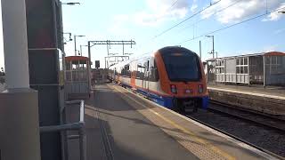 London Overground train departing from Wanstead Park