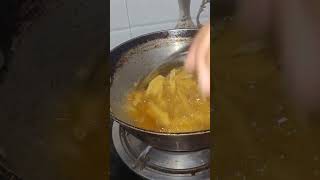 Frying potato fingers in oil