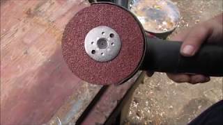 Backing Pad and 36 Grit Resin Fiber Disc on a 4 1/2 Inch Grinder
