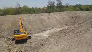 Hundai 210 excavator working on shet Tal