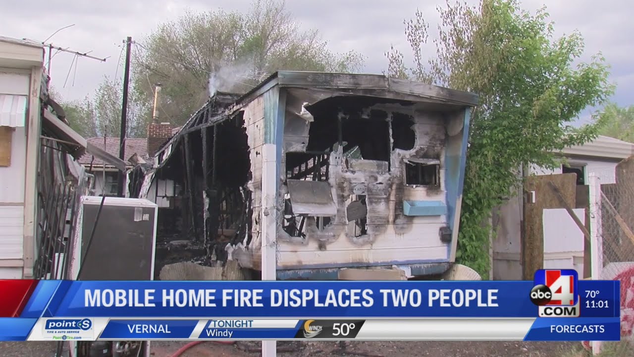 Mobile home fire displaces two people - YouTube