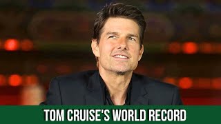 Tom Cruise set a world record by performing 16 jumps with a burning parachute