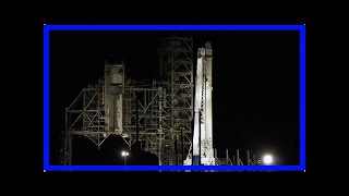 Spacex falcon heavy goes vertical on launch pad, photos show