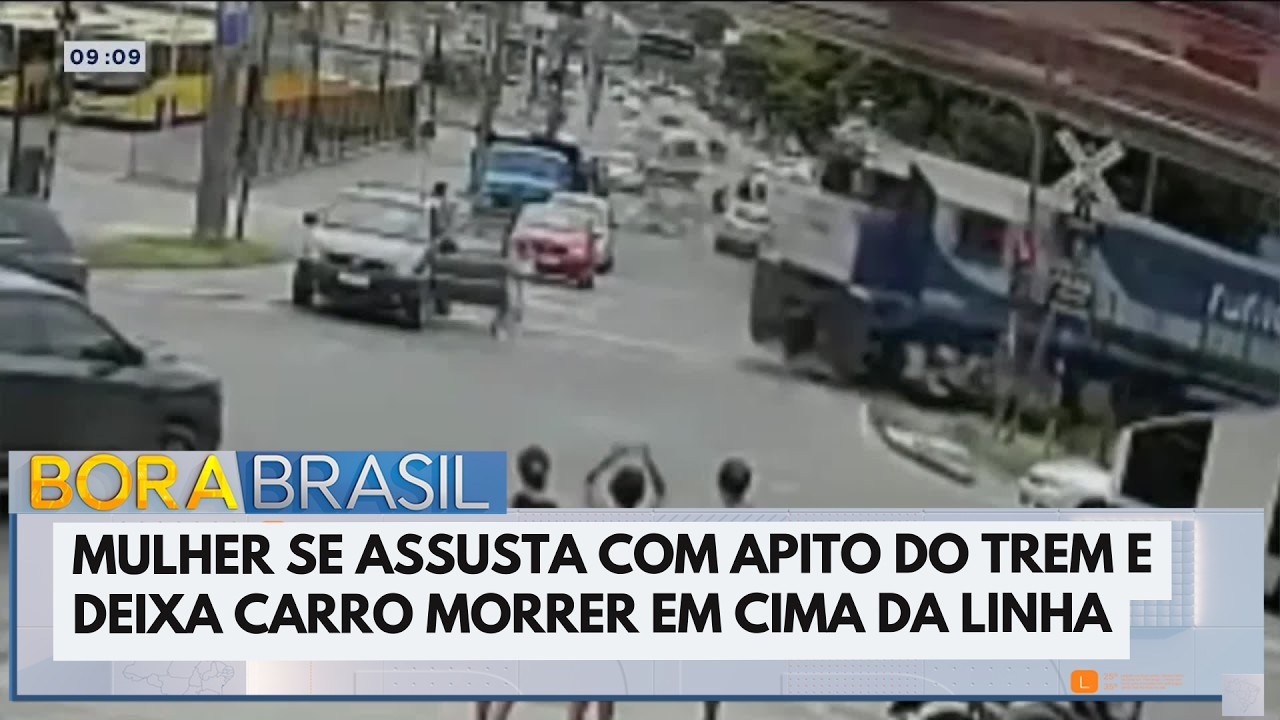 Mulher se assusta com trem e deixa carro morrer em cima do trilho