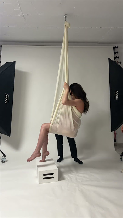 Maternity photography swing hanging pose