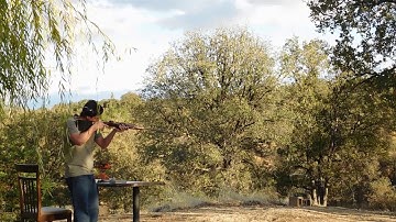 Removing a bullet stuck in a rifle barrel.