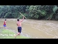 Primitive life: Skills Catch fish by tree in the river and cooking fish