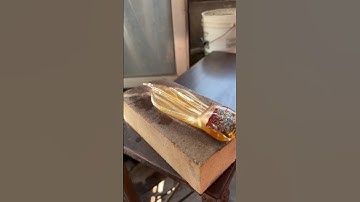 Sylcom Master of Glass shaping a gold leaf