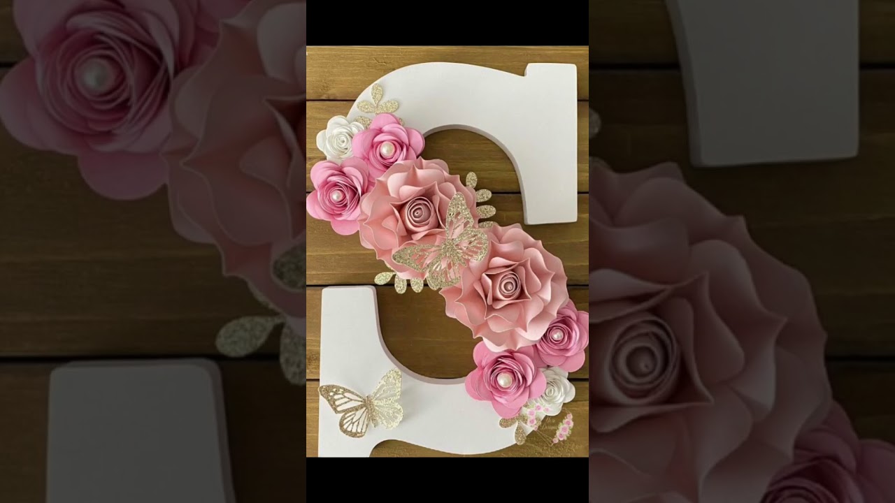 Wooden letter with handmade flowers. 