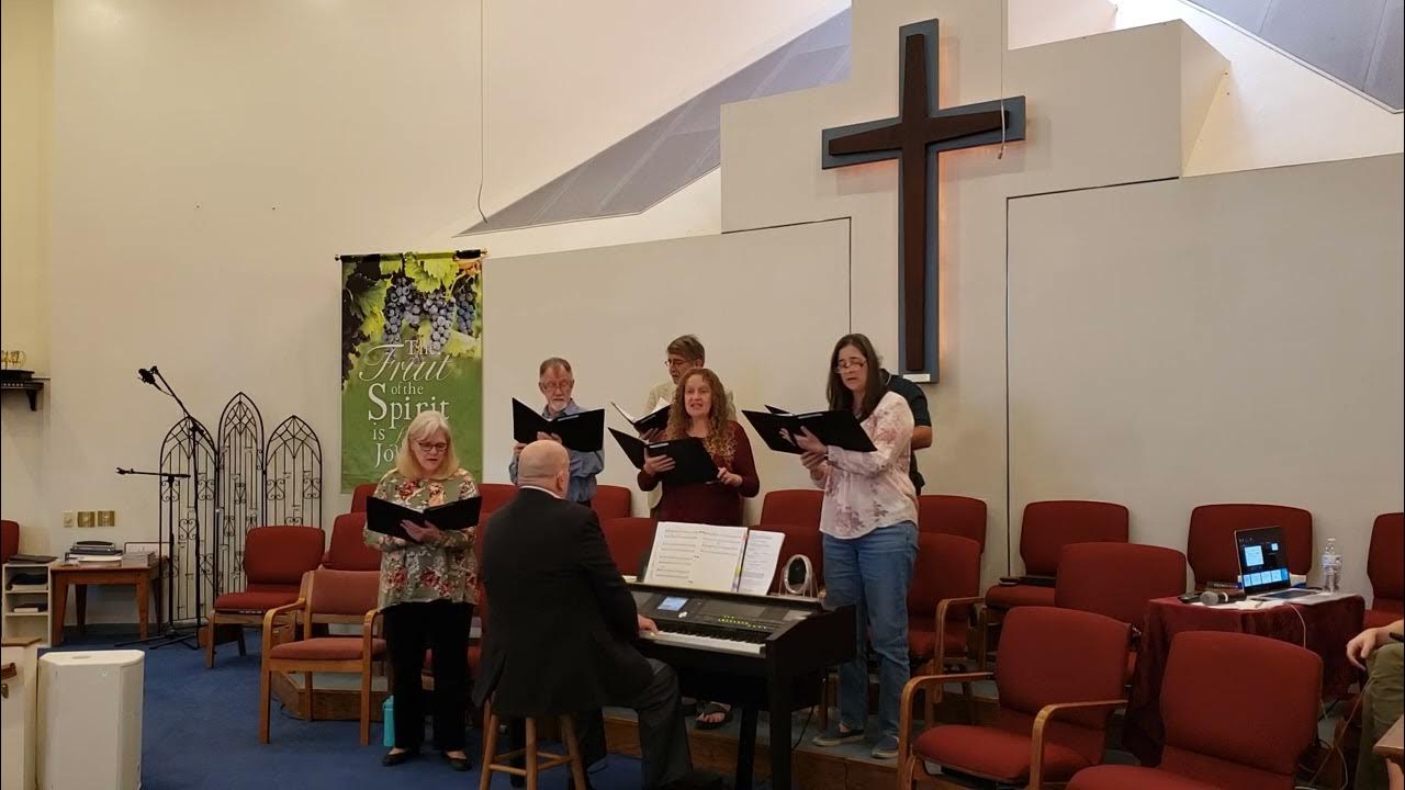 Music director Timothy Holder leads the NHPC Choir "Trust and Obey