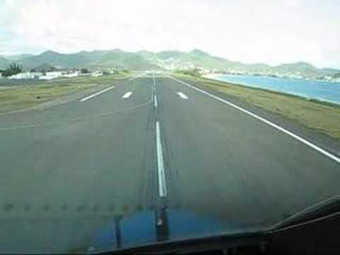 TakeOff from St. Maarten as seen from cockpit 747. To answer some remarks from viewers: Why is T/O so fast and short? Well, the aircraft weighs only 260.000 kgs (max = 396.000kgs) in this T/O with only 30.000 kgs of fuel for a flight time of 1hr15min to Curacao (you can see the landing here: www.youtube.com ). With this low weight Vr is 125kts and climbout speed is 155kts(=V2 + 10kts) Why is V1 and Vr called so close? Because, when a/c is very light you have to increase V1 to the Vmcg(=Vmin control ground)speed. If you don't and start flying below this speed and an outboard engine fails, you are not able to control a/c. That's why in this T/O V1 is the same as Vr. Yes, it's a 747. No, it's not fake. And to answer some more questions: This take off is part of a three stretch flight: AMS-SXM, then SXM-CUR, then CUR-AMS.