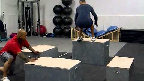 C.J performing rotational box jumps