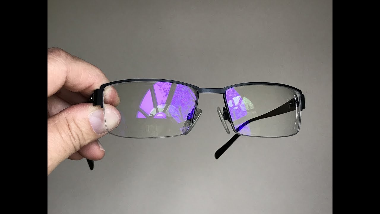 Eyeglasses have a purple reflection 