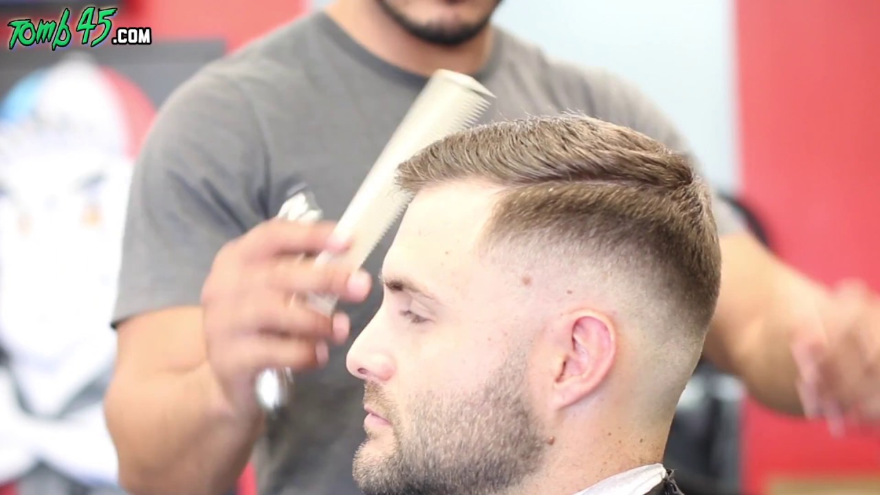 fade haircut with scissors