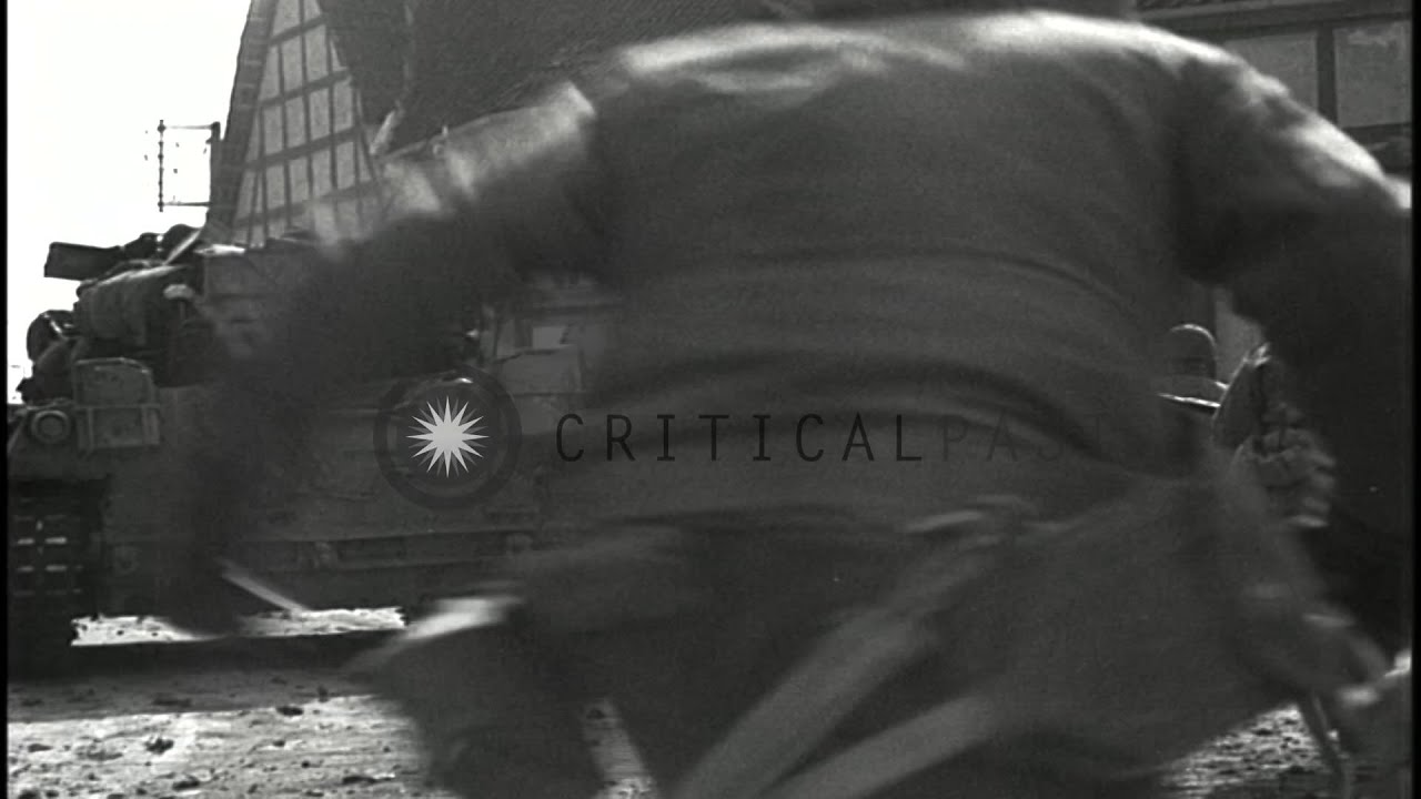 A tank fires machine guns as soldiers advance in Oberdorla, Germany during World ...HD Stock Footage