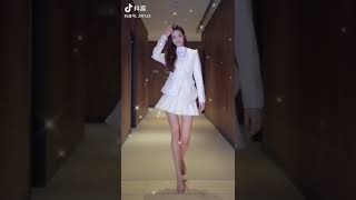 Beautiful lady wear  gorgeous shining white blouse and skirt