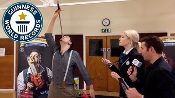 Most swords swallowed in 3 minutes - Guinness World Records