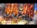 Chinese Street Food in Bangkok, Thailand. Jumbo Lobster, Crispy Pork, Duck, Prawn. Yaowarat Road