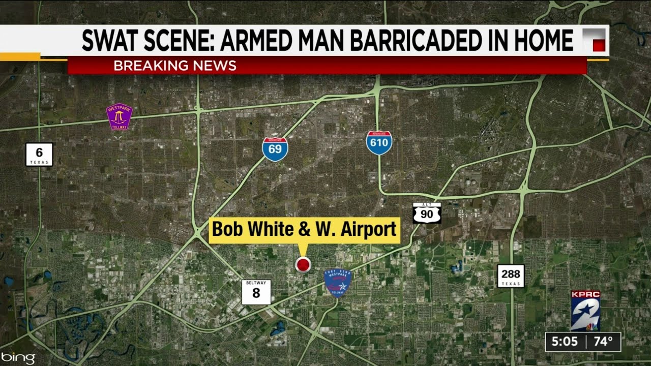 SWAT scene: Armed man barricaded in home - YouTube