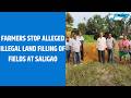 Farmers stop alleged illegal land filling of fields at Saligao